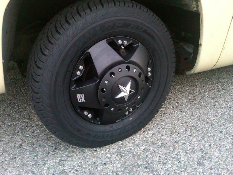 Closeup of left front wheel with starcap on