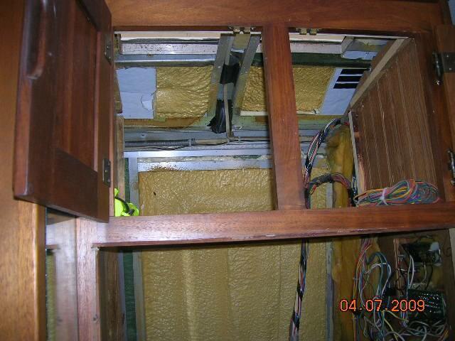 Interior pictures of Rays tankless water heater installation behind refrige
