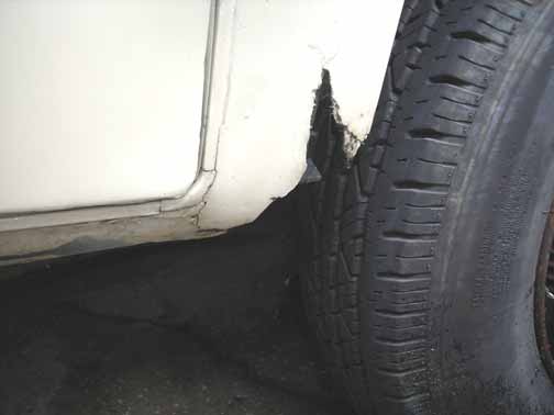 Passenger Front Wheel Well Damage