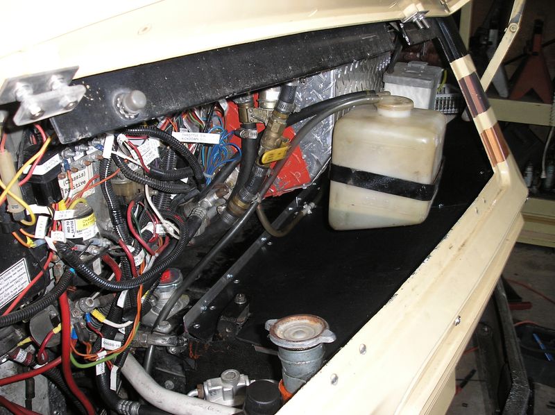 All finished, with radiator overflow tank and windshield washer