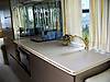 Kitchen_sink_and_gaggenau_electric_cooktop_with_corian_covers.jpg