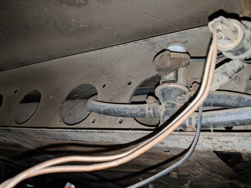 wires hanging under coach