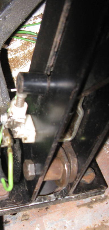 switch mounted on side of parking brake lever housing