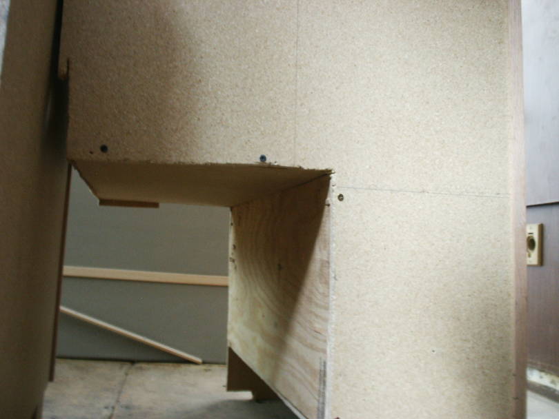 Back of left cabinet showing Wheelwel cutout.