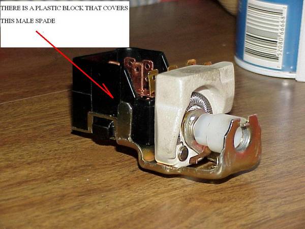 Male grounding spade on headlight switch
