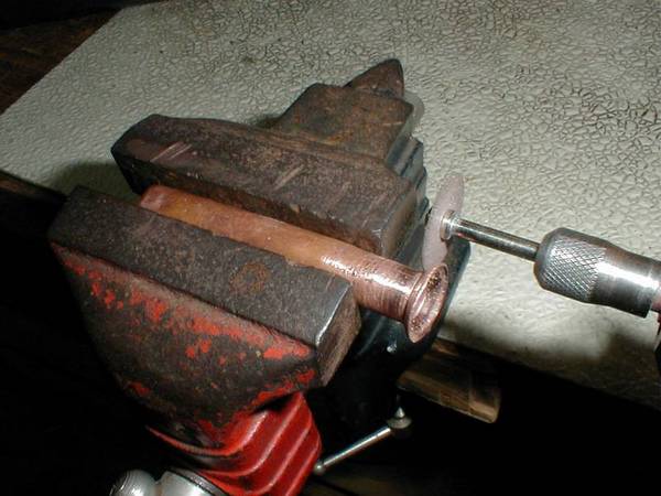 I use a cutting wheel in a Dremel tool to make the cut.