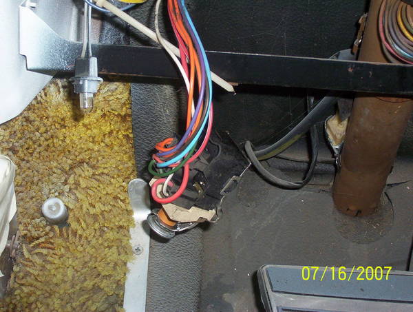 Headlight switch hanging down.