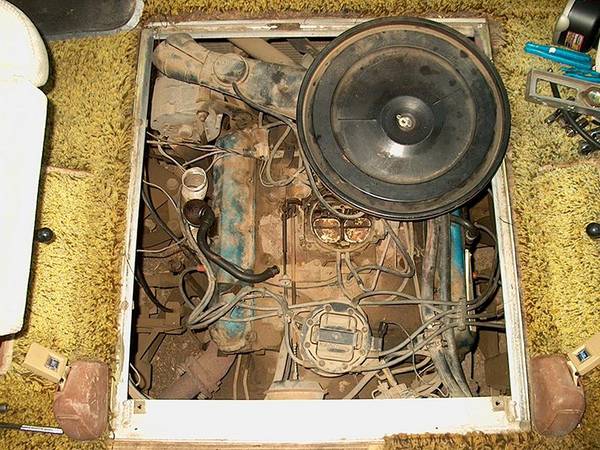 Under the air cleaner