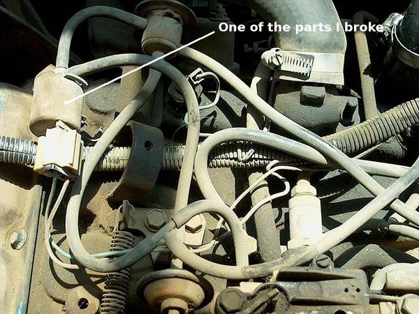 Detail of the vaccum and wiring, front left portion of engine