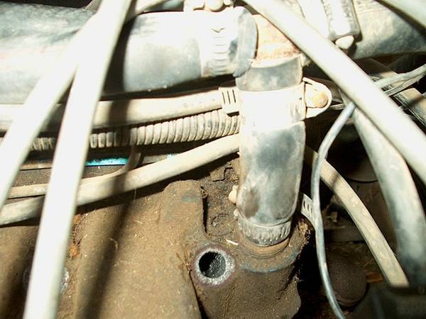 Heater hose at back of manifold