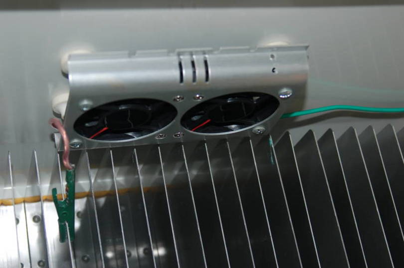 Fan Mounted To Refrig Ceiling.  I had to turn the fans upside down in the m