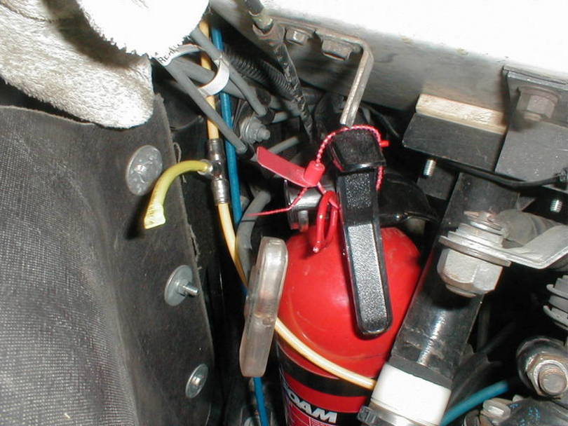 Right beside the radiator on the old compressor shelf.