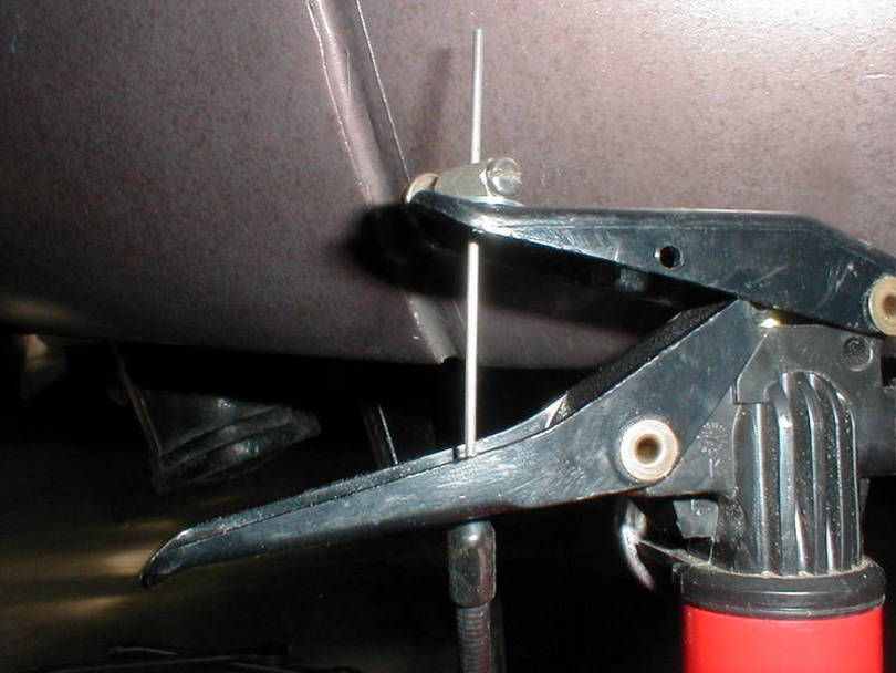 Run the wire thru the handles and permanently install the clamp.