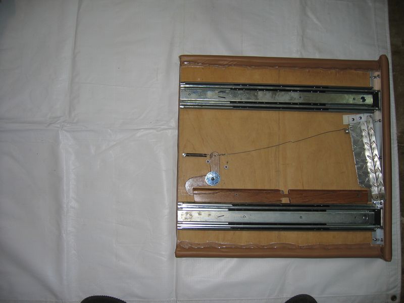 The new top inverted to show slide and latch mounting