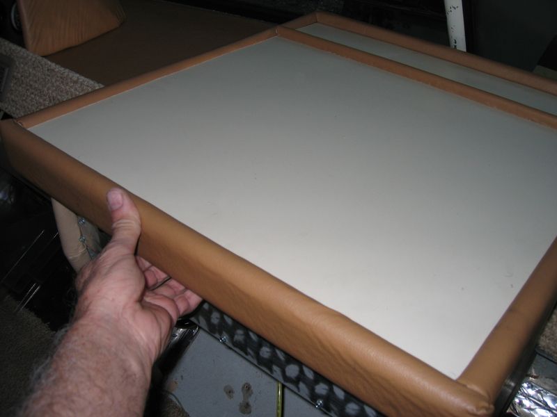 Reaching under the top to release the latch