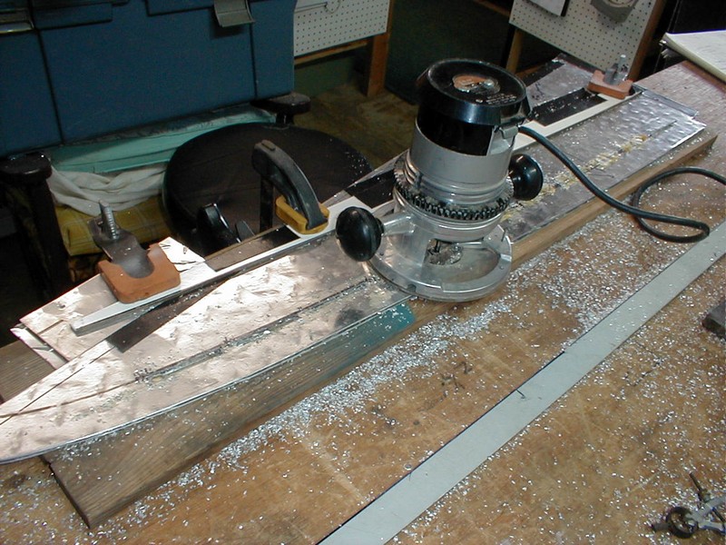 Using a guide fence for router-cutting defroster duct outlet slots.