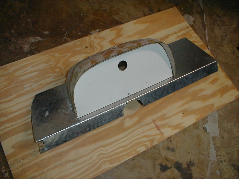 Trimmed cowling with dummy instrument panel on dash top.