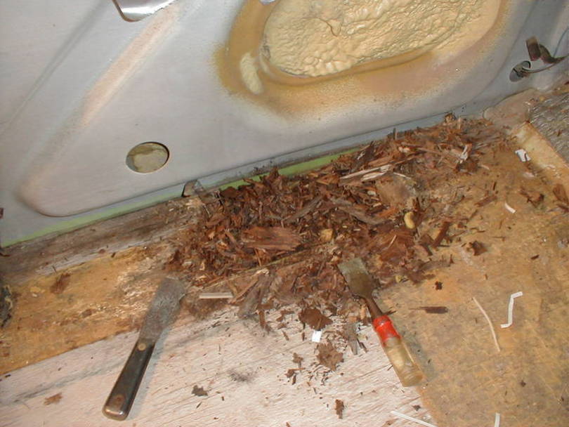 Driver's side floor has typical rot from leaky slide window.