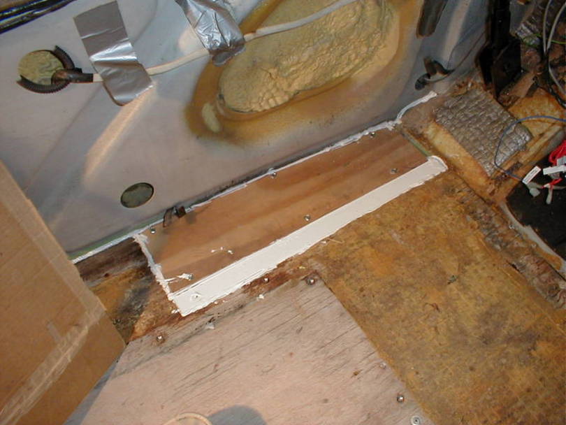 A strip of PVC levels the floor over the joist.