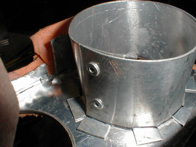 Bend every other tab out 90* and insert the straight ones into the duct hol