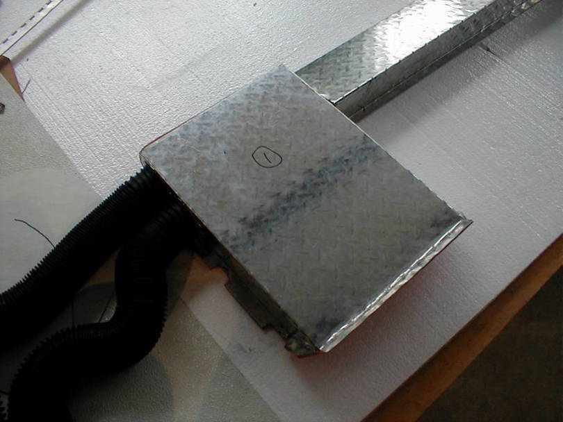 Max air duct with driver hoses and passenger duct.