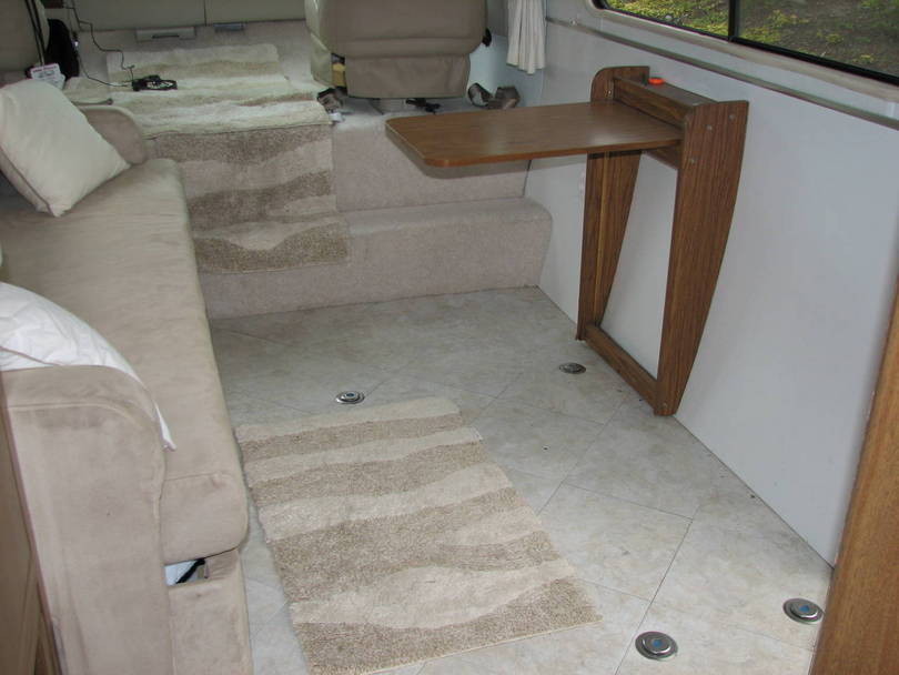 Lounge area with Pull-out table &amp; Wheelchair tiedowns