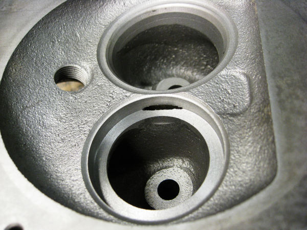 J head exhaust valve insert