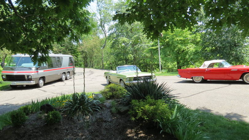 GMC and old cars on my driveway