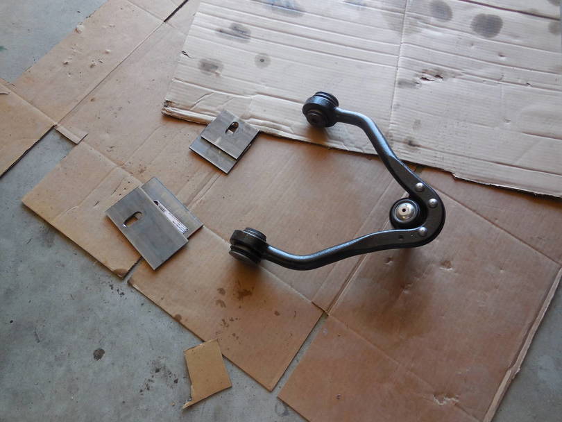 Upper control arm relocation