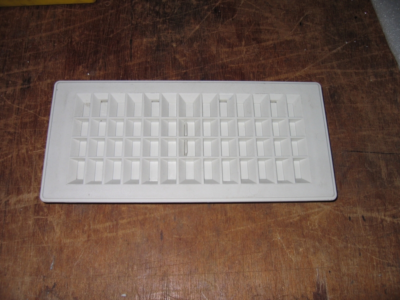 Standard plastic a/c vent.  Closed here.