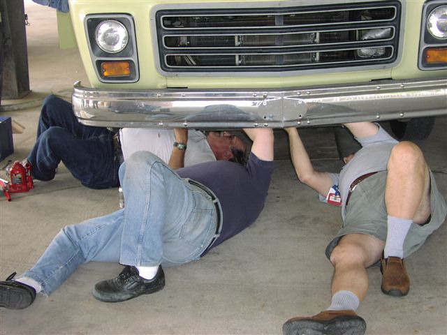 Emery and Tom removing the Blaine Merrell lower radiator guard.