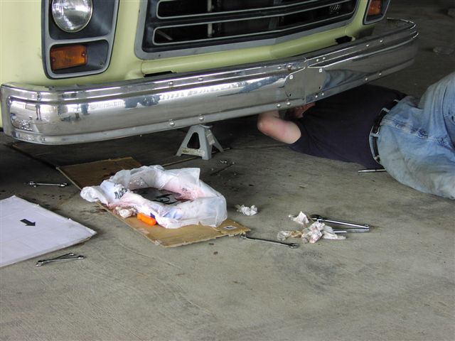 Catching fluids as the lines are removed.