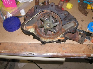 Water pump removed from overheating engine after several hundred miles.