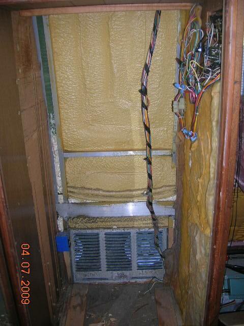 Interior pictures of Rays tankless water heater installation behind refrige
