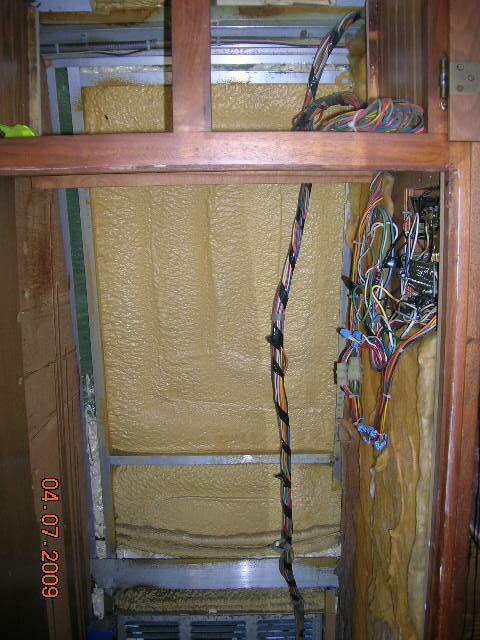 Interior pictures of Rays tankless water heater installation behind refrige