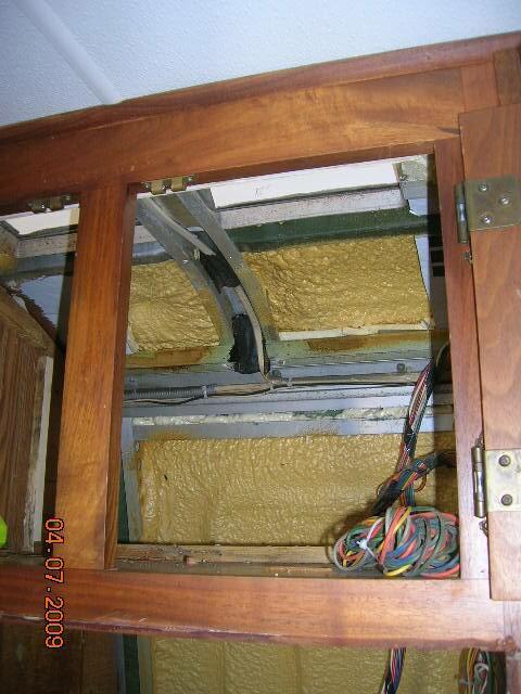 Interior pictures of Rays tankless water heater installation behind refrige