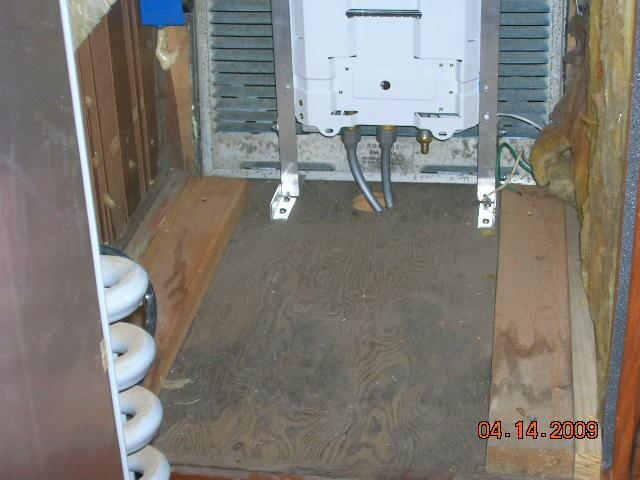 Interior pictures of Rays tankless water heater installation behind refrige