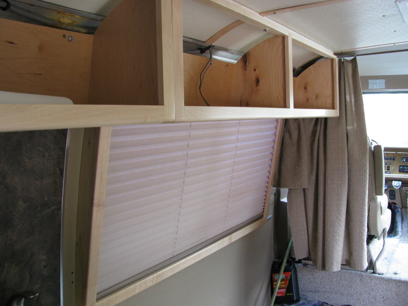 Upper cabinets and valance and shade on driver's side