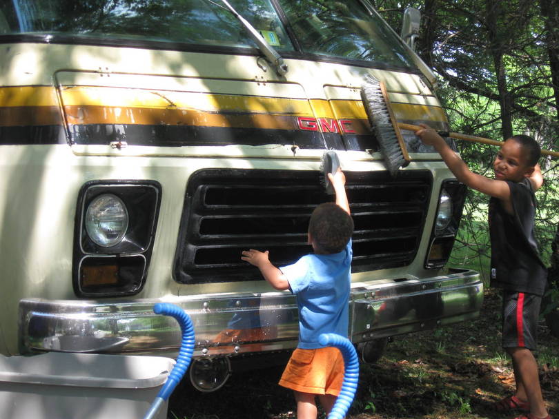Helping Hands...Josh gets more water on Jonah than the GMC