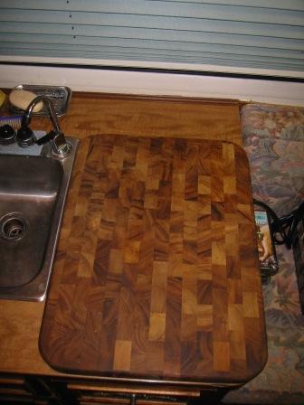 Cutting board folded on top of galley counter