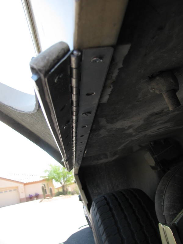 The hinge from the bottom when the skirt is open.