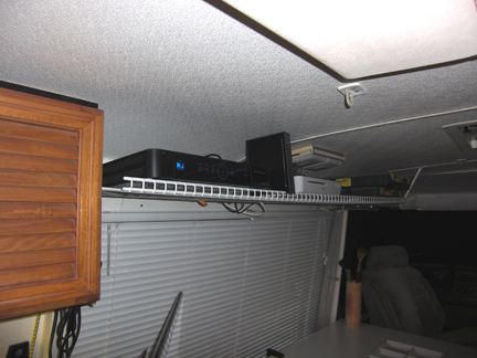 Driver side overhead shelf