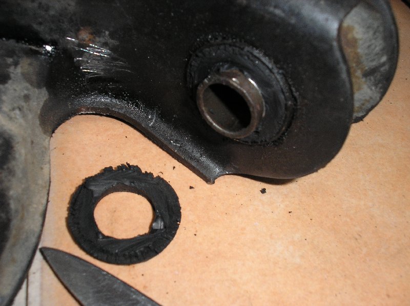 Cutting the rubber flange makes bushing removal easier
