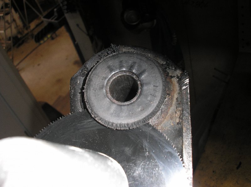 Cutting the bushing flange with a multitool.