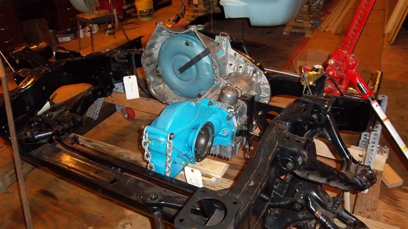 Transmission and final drive mounted in front clip (subframe)