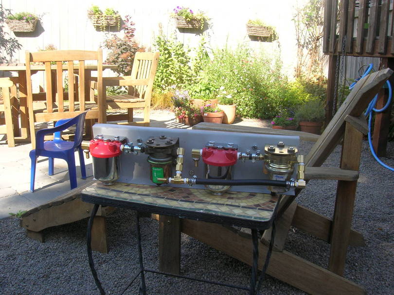 each tank feeds a filter and pump, selector solenoid valve is eliminated