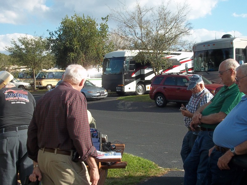 Brain trust installing Henderson electric wipers on Pinkerton coach