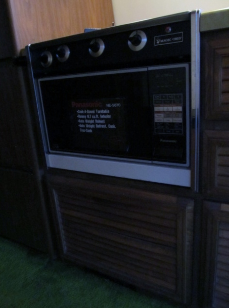 microwave / gas range controls / storage cabinet