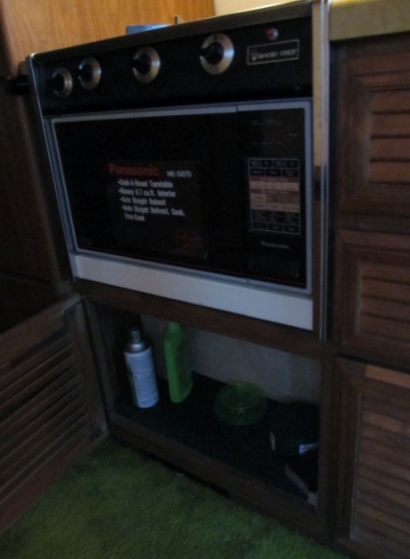 microwave / gas range controls / storage cabinet