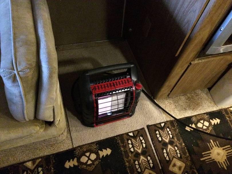 The hose is long enough so I can set the heater in various spots .